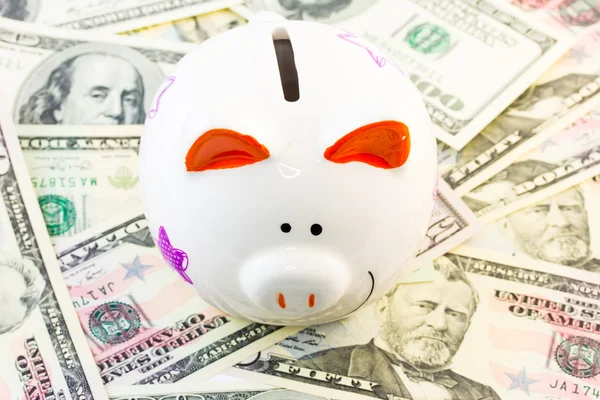 Piggy bank and dollars — Stock Photo, Image