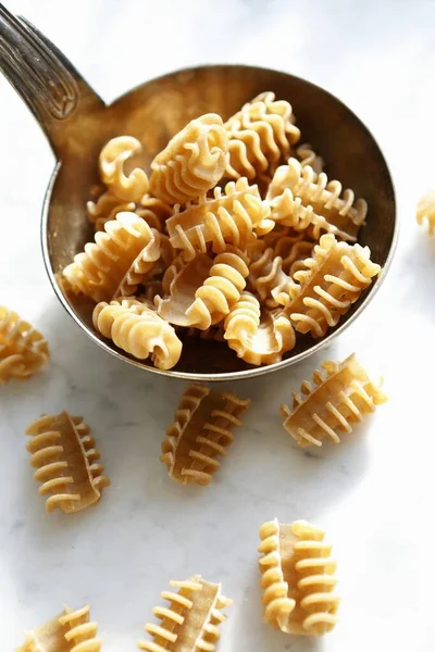 Uncooked Armoniche Pasta Ladle — Stock Photo, Image
