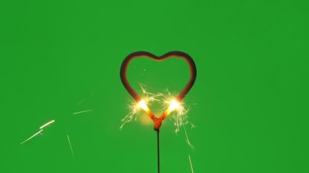 Burning Bengal Fire Heart Shape Sparks Green Background — Stock Video
