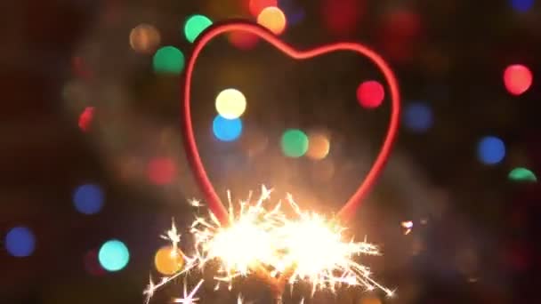 Burning Bengal Fire Heart Shape Sparks Defocused Background Slow Motion — Stock Video