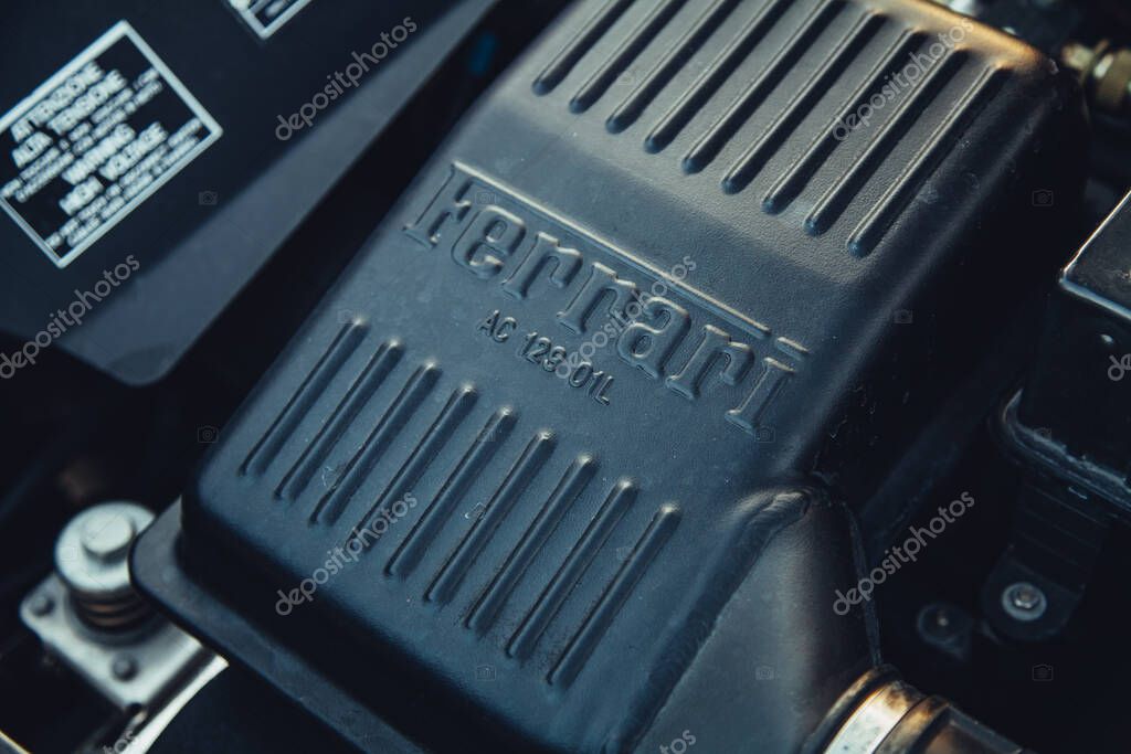 Vilnius, Lithuania - 2025-09-20 - Ferrari lettering on engine component of vintage Ferrari Berlinetta