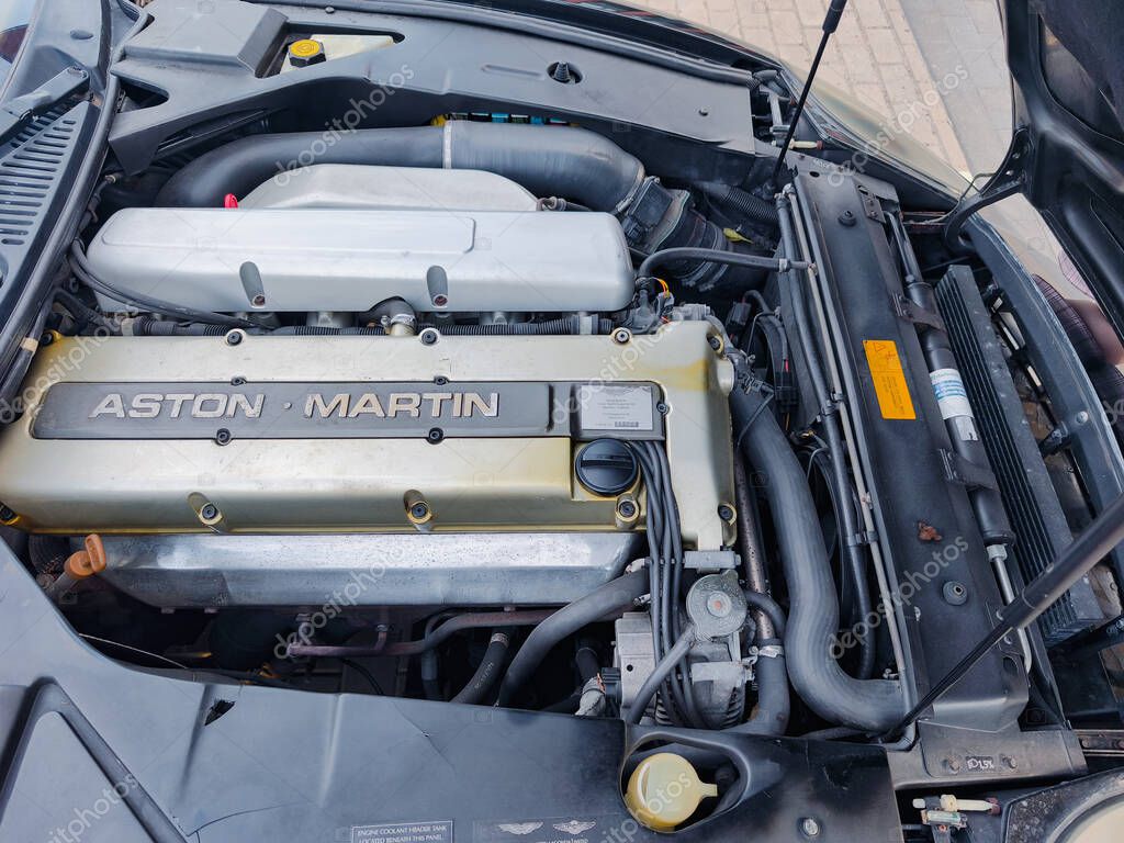 Vilnius, Lithuania - 2025-07-17 - Under the hood of Aston Martin with visible logo and engine components