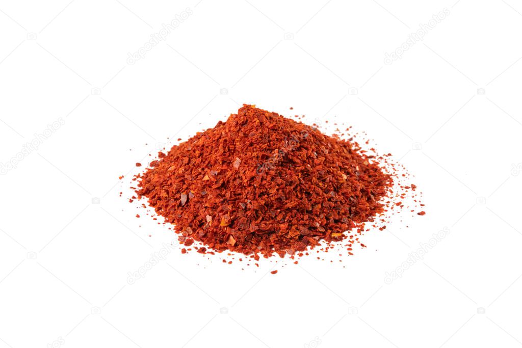 chilli pepper seedless flakes heap isolated on white background. Spices and food ingredients. in Korea known as Gochugaru. Used for Kimchi.