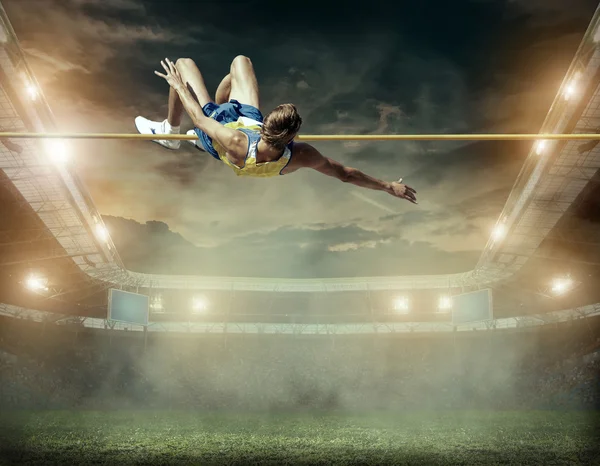 Atleta em ação de salto em altura — Fotografia de Stock