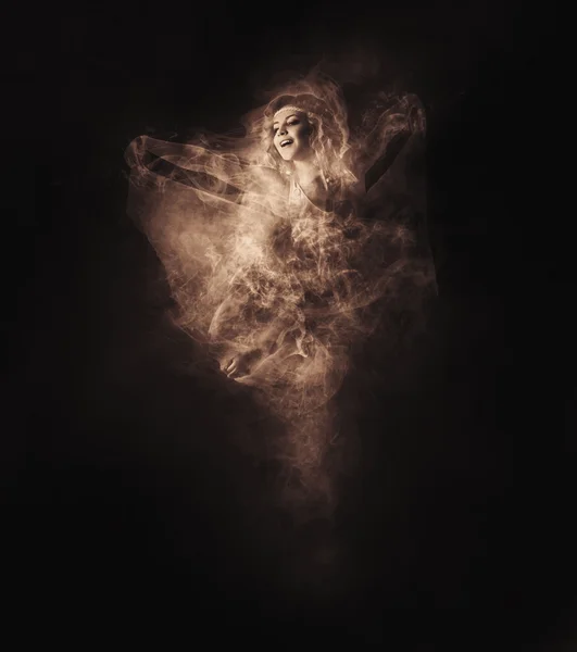 Dancer from smoke on dark — Stock Photo, Image