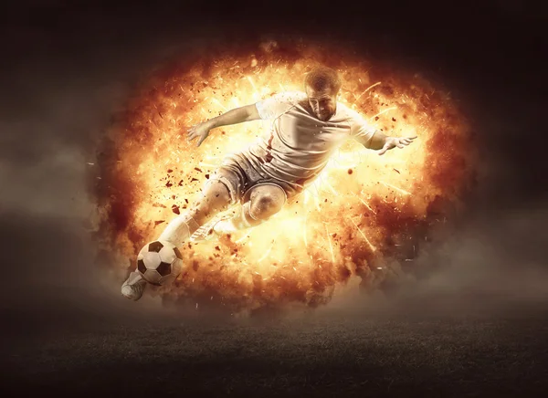Fotbalista v plameni ohně — Stock fotografie