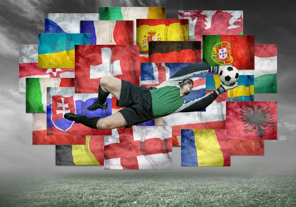 Soccer player on flags background — Stock Photo, Image