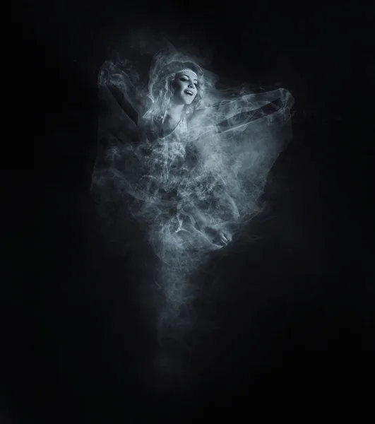 Dancer from smoke on dark — Stock Photo, Image