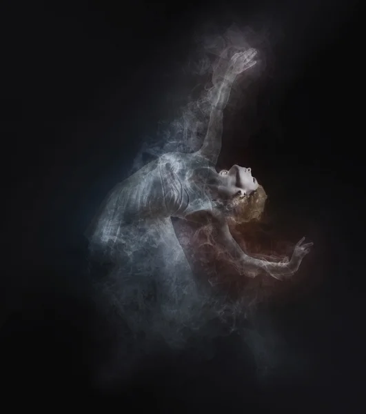 Dancer from smoke on dark — Stock Photo, Image