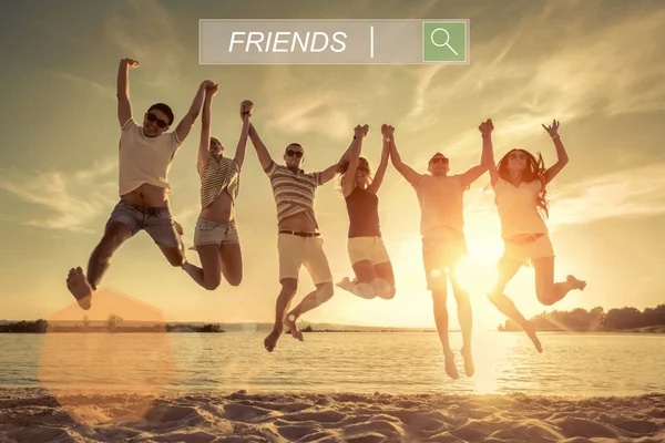 Friends Jumping Beach Sunset Sunlight — Stock Photo, Image