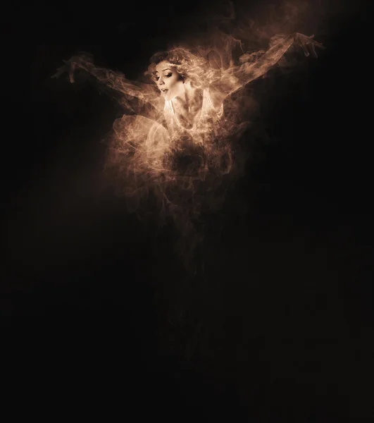 Dancer from smoke on dark — Stock Photo, Image