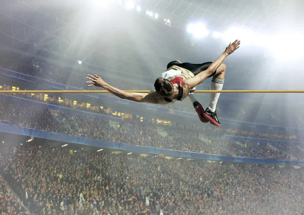 Sportovec v akci ve skoku vysokém — Stock fotografie