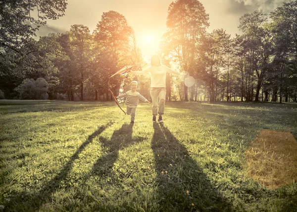 Little boy and mother playing with kite — Stock Photo, Image