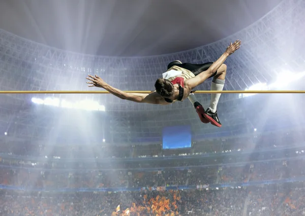 Atleta em ação de salto em altura — Fotografia de Stock