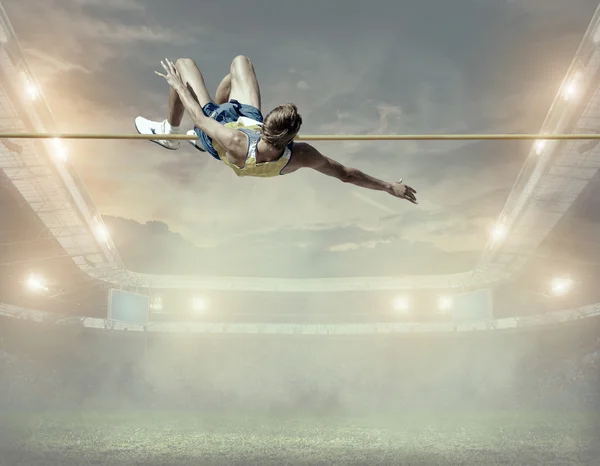 Atleta em ação de salto em altura — Fotografia de Stock