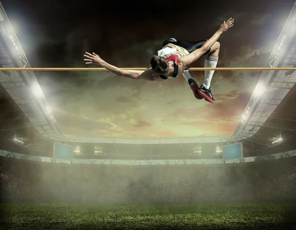 Atleta em ação de salto em altura — Fotografia de Stock