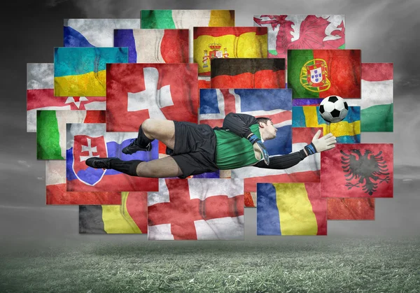 Soccer player on flags background — Stock Photo, Image