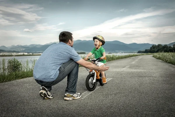 Father and son on bicycle — Stock Photo, Image