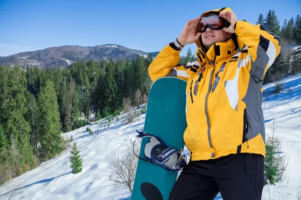 Men in goggles with snowboard — Stock Photo, Image