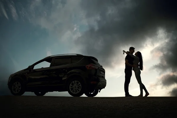 Happy couple near new car — Stock Photo, Image