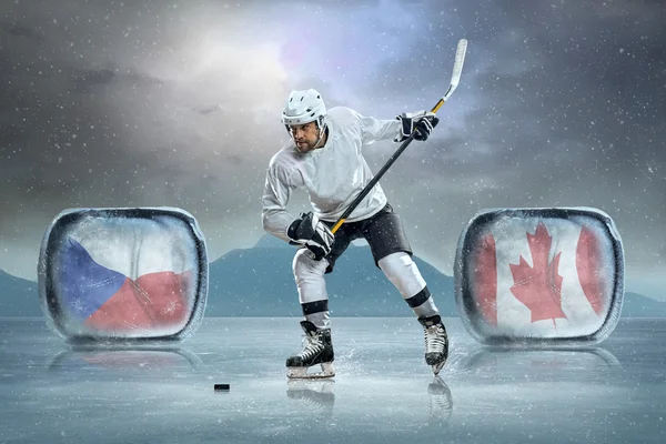 Ice hockey player on ice Stock Photo