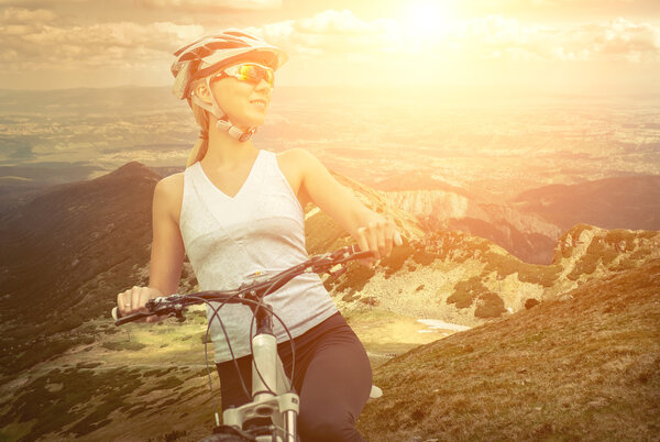 Beautiful woman  on the bicycle