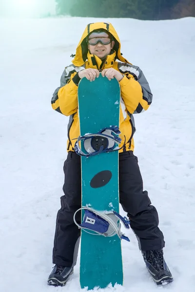 Man in goggles with snowboard — Stock Photo, Image