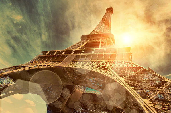 The Eiffel tower is one of the most recognizable landmarks in the world under sun light