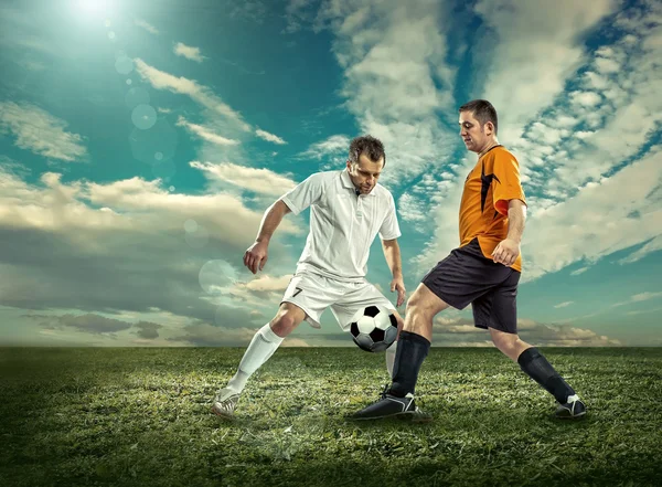 Two football players with ball — Stock Photo, Image