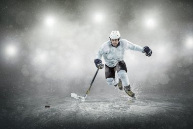 Ice hockey player on the ice clipart