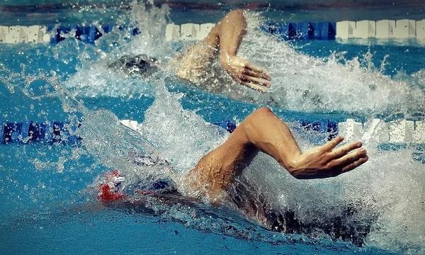 Freestyle in waterpool with blue water — Stock Photo, Image