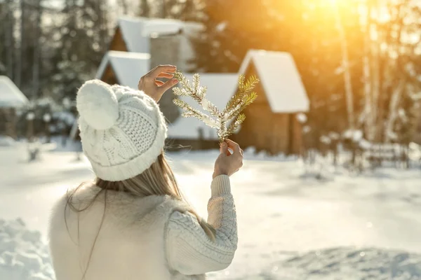 Happy female near the winter villa i