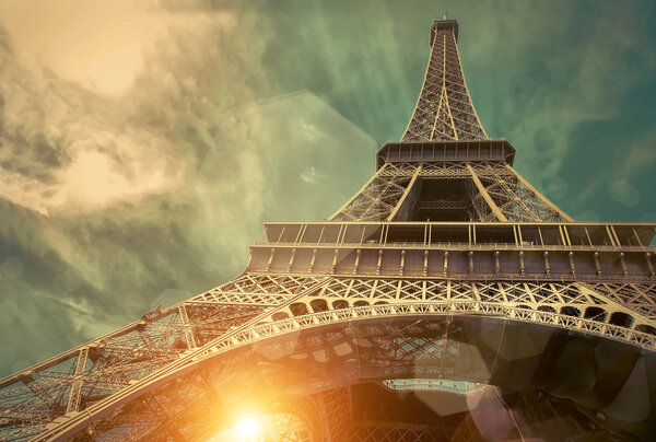 Eiffel tower is one of the most recognizable landmarks in the world under sun light