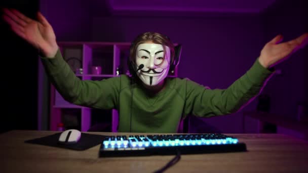 Emotional Man Guy Fawkes Mask Uses Computer Night Actively Gestures — Stock Video