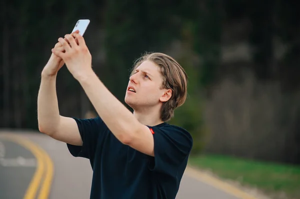 Serious Young Male Tourist Looking Mobile Network Smartphone Mountains While — Stock Photo, Image