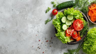 Top view flat lay of fresh salad vegetables lettuce, tomato, cucumber, and carrot on rustic background with copy space, bright natural light, healthy food concept, clean realistic style for website or print use.
