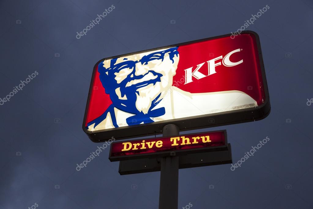 DALLAS, Tx, USA - APR 17, 2016: Logo of a Kentucky Fried Chicken (KFC) fast food restaurant illuminated at night. Dallas, Texas, United States