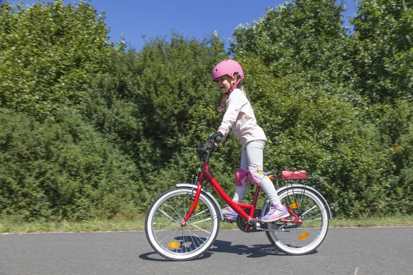 Girl riding bicycle — Stock Photo, Image