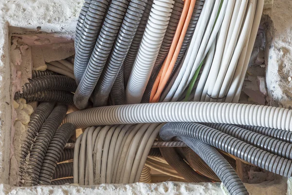 Cables and pipes in the wall — Stock Photo, Image