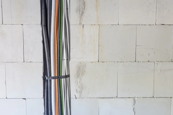 Cables and pipes in the wall — Stock Photo, Image