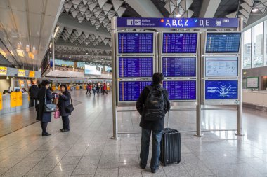 FRANKFURT - DEC 6: Departures Information Board at the Frankfurt International Airport. December 6, 2014 in Frankfurt Main, Germany clipart