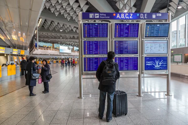 FRANKFURT - DEC 6: Departures Information Board at the Frankfurt International Airport. December 6, 2014 in Frankfurt Main, Germany — Stock Photo, Image