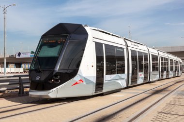 DUBAI, UAE - DEC 16: New tram service in the city of Dubai. December 16, 2014 in Dubai, United Arab Emirates clipart