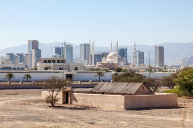View over the city of Fujairah, Heritage Village in the foreground. United Arab Emirates clipart