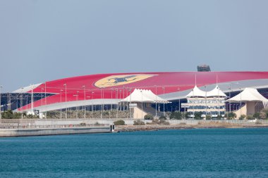 ABU DHABI - DEC 23: Ferrari World amusement park at Yas Island in Abu Dhabi. December 23, 2014 in Abu Dhabi, United Arab Emirates clipart
