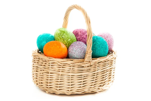 Easter eggs in a basket isolated over white — Stock Photo, Image