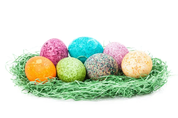 Colorulf easter eggs nest isolated on white background — Stock Photo, Image