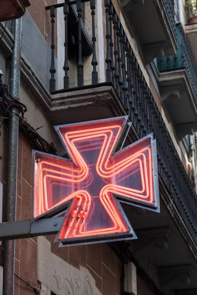 Red pharmacy sign or drug store symbol — 图库照片