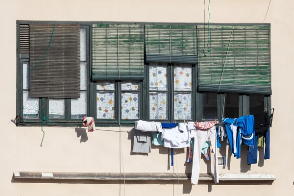 Laundry drying on a wire in Spain — Stock Photo, Image