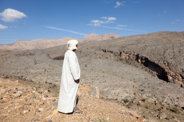 Tourist Guide at the Wadi Ghul, Oman clipart